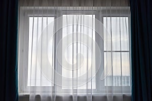 Windows with curtains in rental apartment