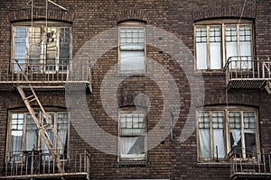 Windows and fire escapes tenement brick apartment building