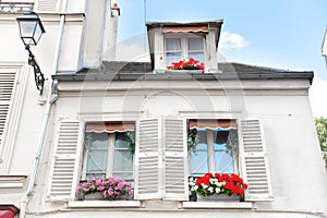 Windows with flowers on Montmartre street