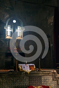 Windows in the form of a cross, view of the altar of the temple in Tatev Monastery