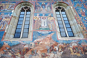 Windows and frescoes in a painted monastery chuch, Bukovina, Moldavia, Romania