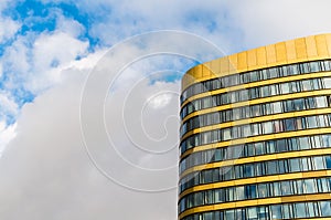 Windows and golden facade of Skyscraper Business Office against