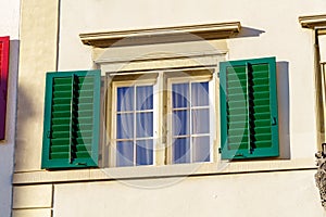 Windows with green shutters on old houses in the city, Zurich, S