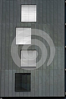 Windows on Grey Wall. Fragment of Facade of Modern Building. Arhitectural Background