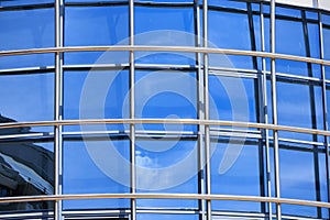 windows and metal structure on the wall of modern buildings of business centers. Background texture modern