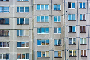 Windows mirroring home building in block of flats