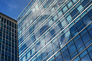 Windows on modern glass and steel skyscraper building - abstract business background