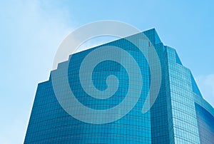 Windows of modern office skyscraper building with blue sky. Arch