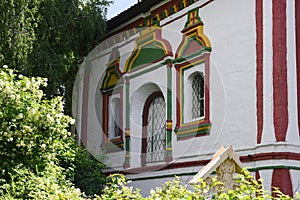 Windows and multicolored trim of the platbands of the medieval Orthodox Trinity Cathedral in Kolomna, Russia