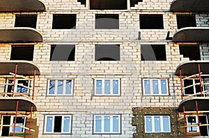 windows in a newly built house. wall structure with insulated non-combustible material basalt fiber tiled