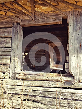 Windows of an old abandoned traditional rustic wood house. Fundata Romania