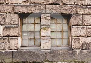 Windows on an old block wall