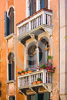 Windows on the old building in Venice canal, Italy