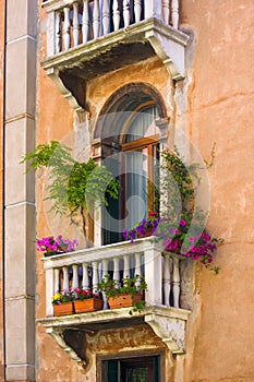 Windows on the old building in Venice canal, Italy