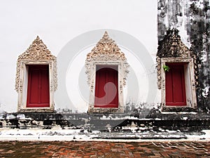 The windows of the old temple at Wat-chom-phu-wek Thailand.