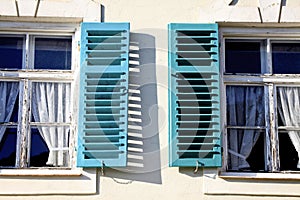 Windows with open shutters