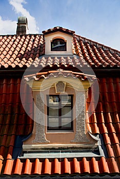 Windows on orange roofs in Prague