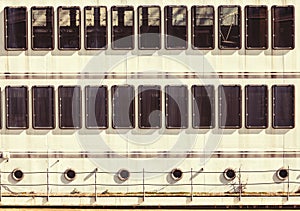 Windows portholes facade of a ship. Regular background