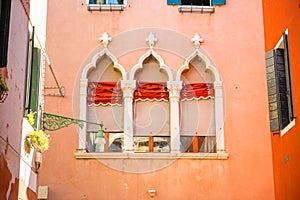 Windows on red wall in old house