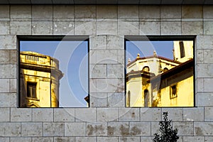 Windows and reflections on facade of building