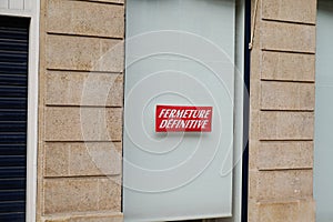 Windows shop panel fermeture definitive french text means final closure on panel sign written on store facade in france photo