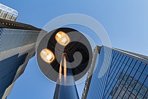 Windows of skyscraper business office building with street lamp at front, Corporate buildings in city