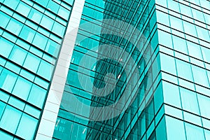 Windows of skyscraper in Tel Aviv, Israel. Teel filter photo
