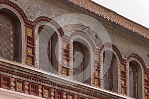 Windows and stucco decorations of ancient chambers of the Rostov Kremlin.