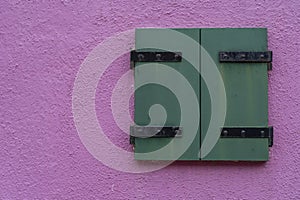 Windows of Venice, Murano and Burano. Picturesque windows with shutters on the famous island Burano. Decorated window on colorful