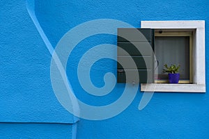Windows of Venice, Murano and Burano. Picturesque windows with shutters on the famous island Burano. Decorated window on colorful