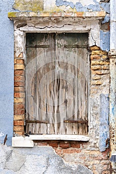 Windows of Venice, Murano and Burano. Picturesque windows with shutters on the famous island Burano. Decorated window on colorful