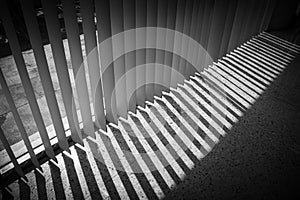 Windows with vertical blinds, Detail of the interior texture with lights and shadows on the floor