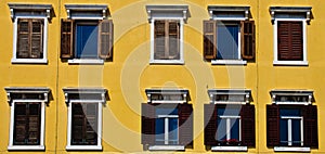 Windows with wooden shutters