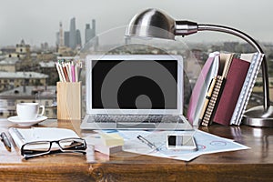 Windowsill workplace with laptop