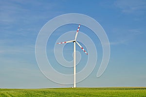 Windpower station in a cornfield photo