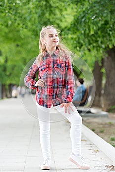 Windproof hairstyles. Girl little cute child enjoy walk on windy day nature background. Feeling cozy and comfortable on