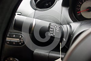 Windscreen wiper control switch in car. Wipers control. Modern car interior detail. adjusting speed of screen wipers in car.