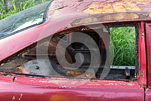 Windshield of abandoned rusted car