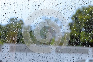 Windshield rain drop on car window.