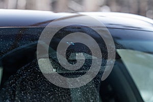 Windshield rain and light sensors of modern car.