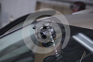 Windshield repair. repair of a chip on the windshield of a car