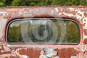 Windshield of rusted truck