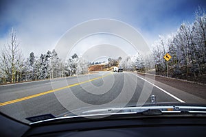 Windshield view of road in winter