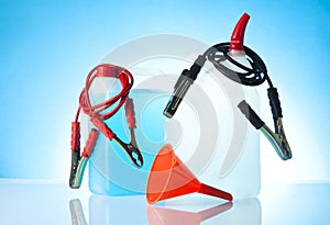 Windshield washer fluids and jump start cables with funnel