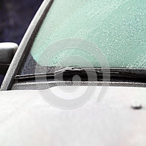 Windshield and wiper coveed with ice