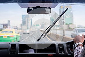 Windshield wipers from inside of car, rainy season