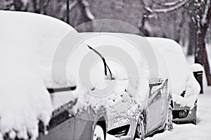 Windshield wipers of an snow covered car