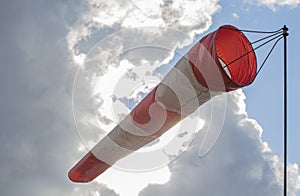 Windsock against the sky with clouds. Closeup.