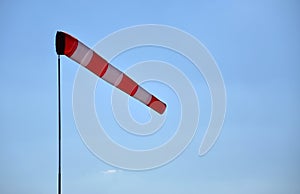 Windsock indicating wind, blue sky