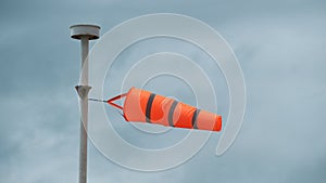 Windsock indicator of wind on tank chemical cone indicating wind direction and force.